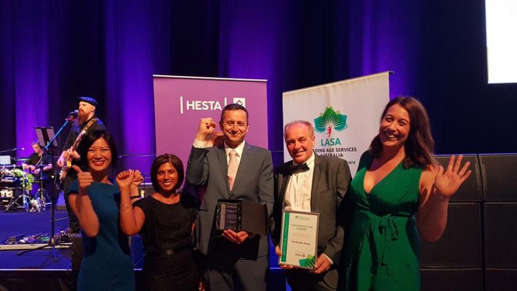 Whiddon staff holding awards won at the 2018 Leading Aged Care Services Awards.