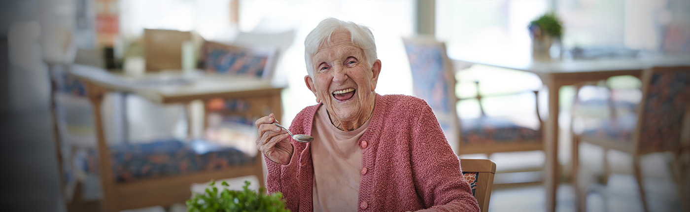 resident enjoying a meal