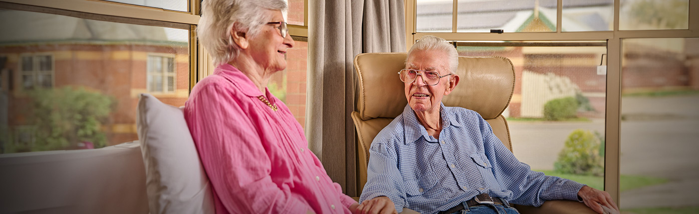 resident sitting with their family member