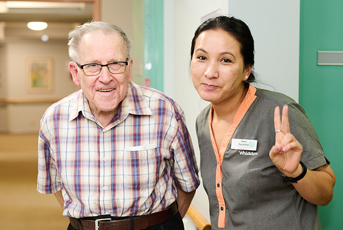 resident posing with care worker